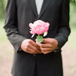 Мужчина с розовым пионом