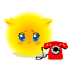 Желтый пушистый смайлик грустит у  телефона