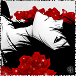 Темноволосый  парень лежит среди красных роз и  грустит