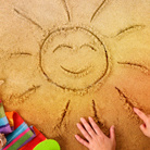 Солнце нарисованное на песке