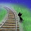 Чёрный котик около железной дороги
