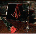 Бокал вина,роза и огненная картинка на столе