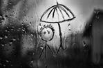 Смешной человечек с зонтиком, нарисованный на залитом дож...