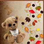 Медвежонок на фоне осенних листьев